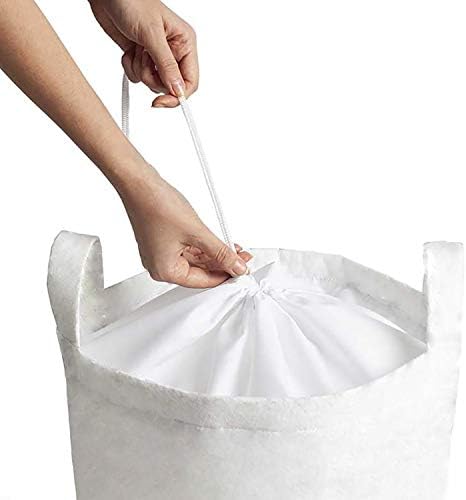 Jesenska torba za rublje u boji jesenskog lišća na jednobojnoj pozadini košara za rublje s ručkama i kopčom na vezicu za praonice rublja